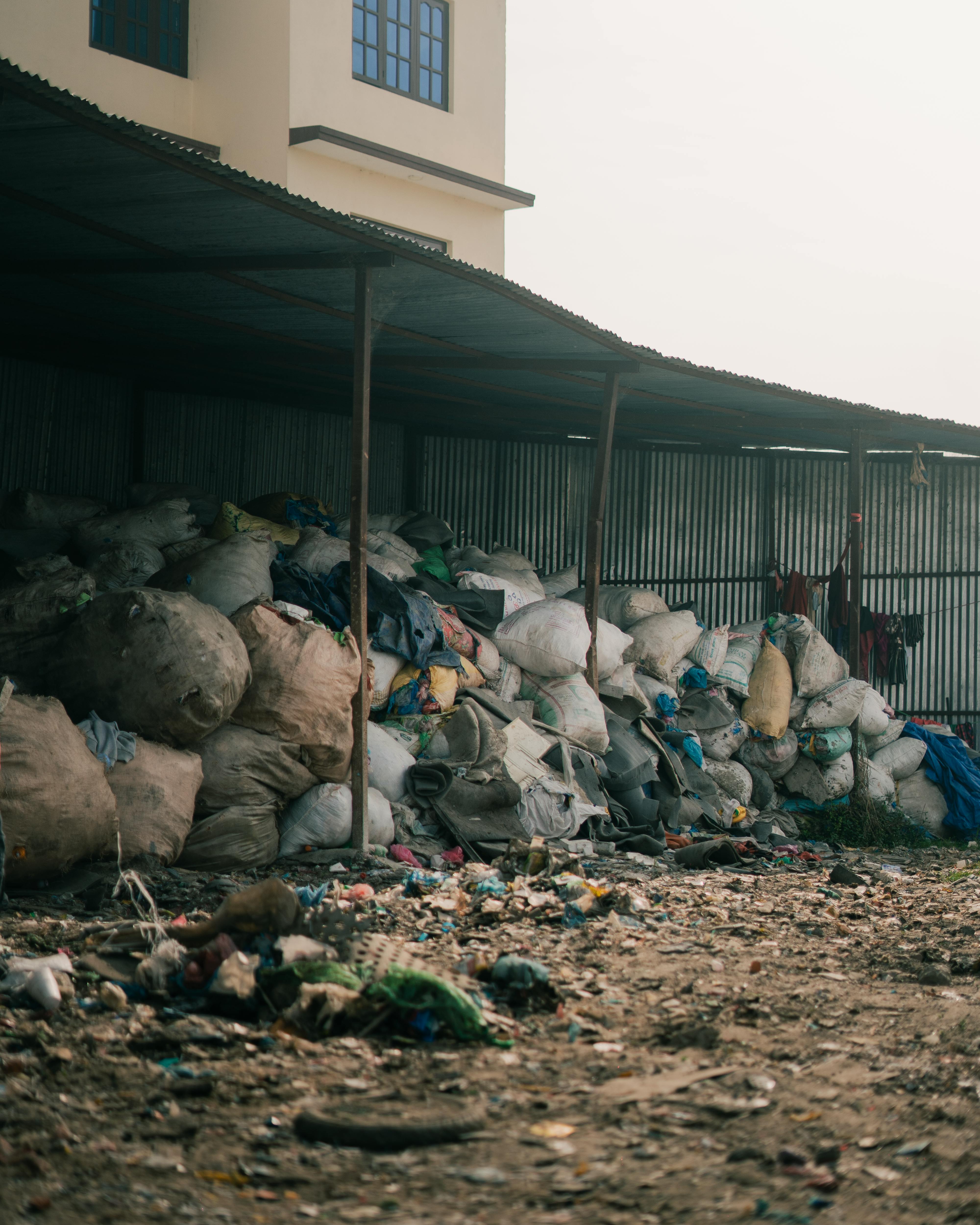 Pile of garbage in front of a building.